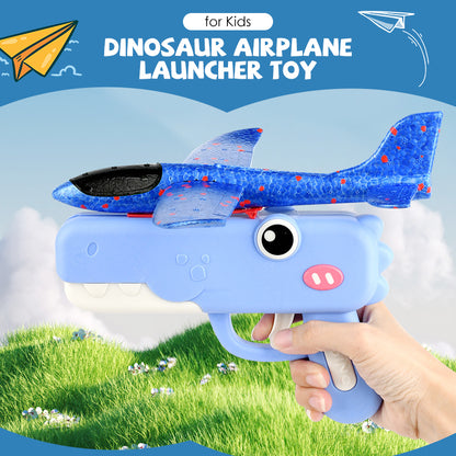 Giocattolo lanciatore di aeroplani a forma di dinosauro per bambini