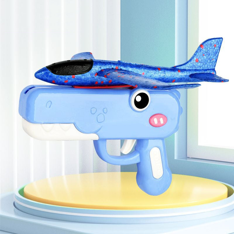 Giocattolo lanciatore di aeroplani a forma di dinosauro per bambini