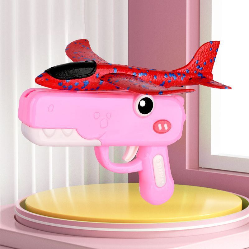 Giocattolo lanciatore di aeroplani a forma di dinosauro per bambini