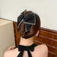 Elegante fermaglio a artiglio per capelli con grande fiocco