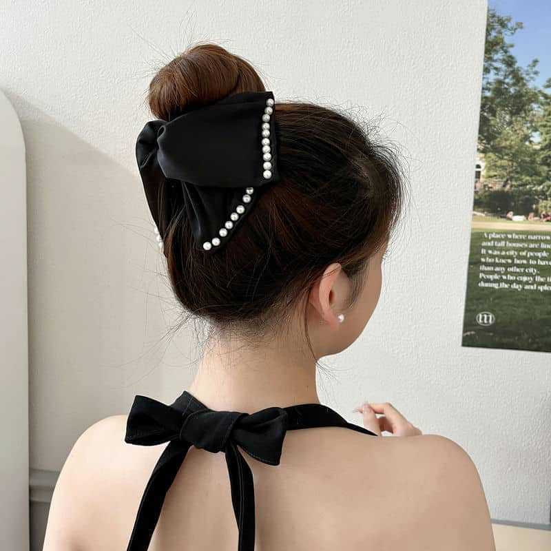 Elegante fermaglio a artiglio per capelli con grande fiocco