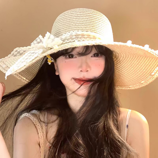 Cappello alla moda a tesa larga con fiocco in pizzo